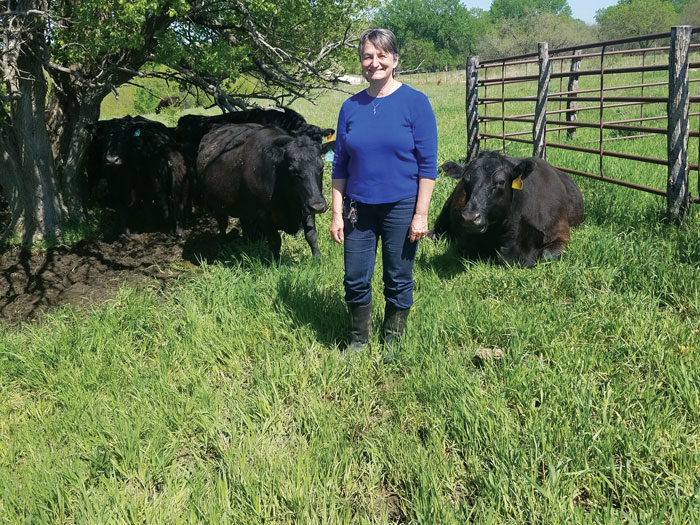 Lucinda-Stuenkel-with-cows.jpg
