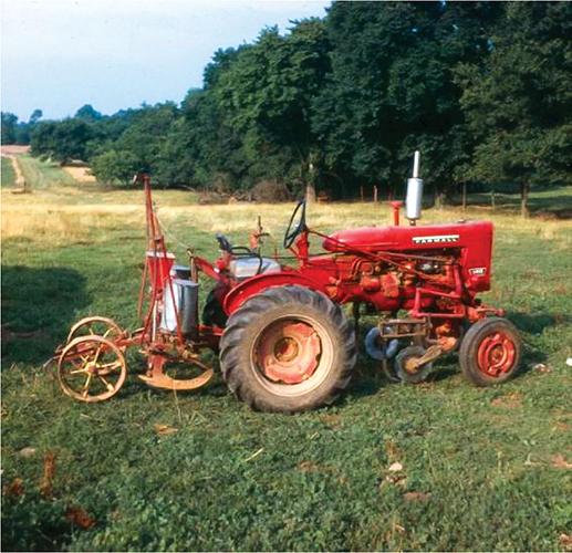 Harry Young hooked a modified mule-drawn, two-row planter to a small tractor to plant the first crop of commercial no-till corn in 1962.